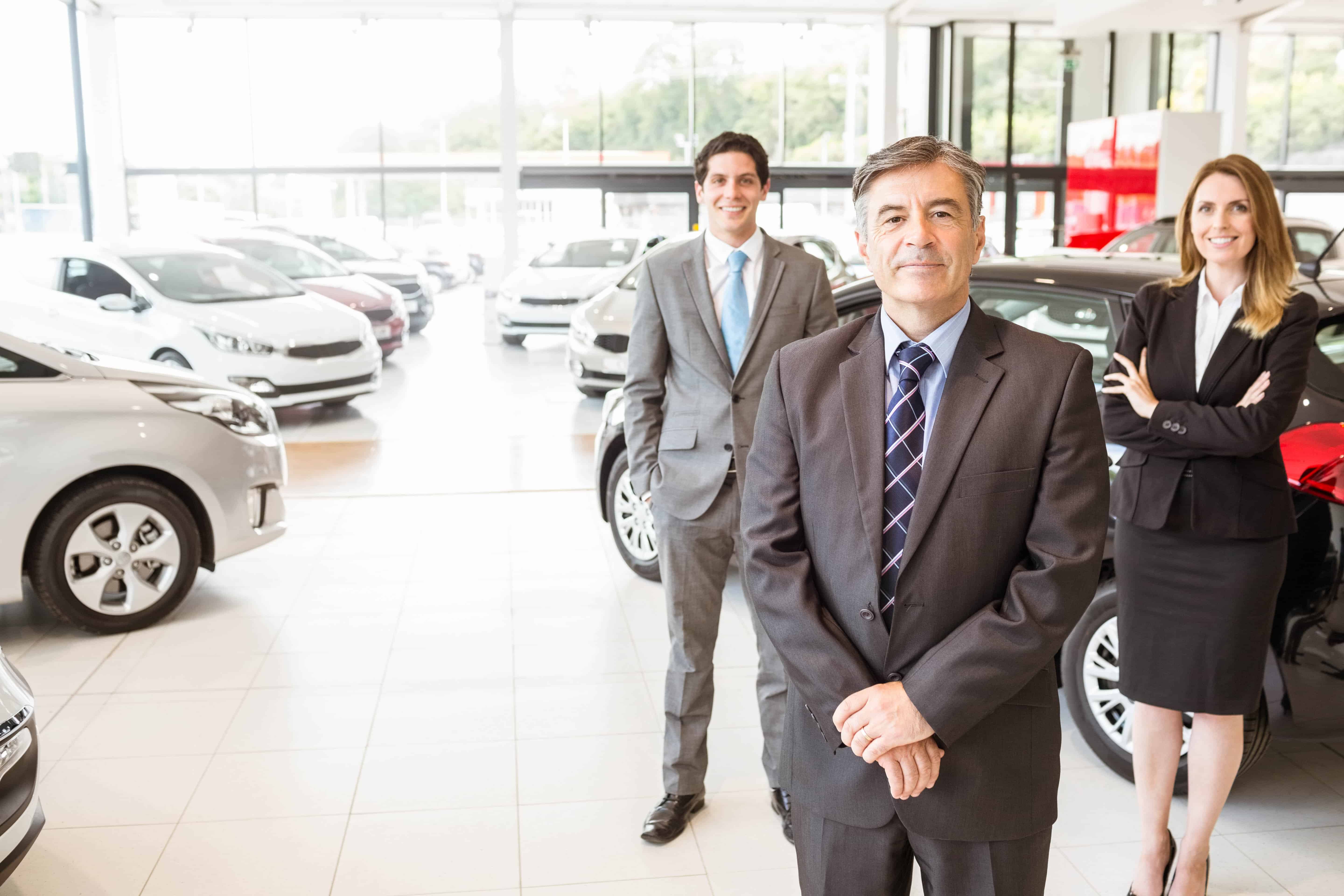 Smiling dealership associates
